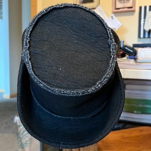 Black Kangol shearling hat.